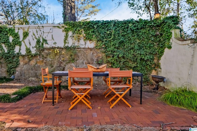 view of patio / terrace featuring a fenced backyard and outdoor dining area