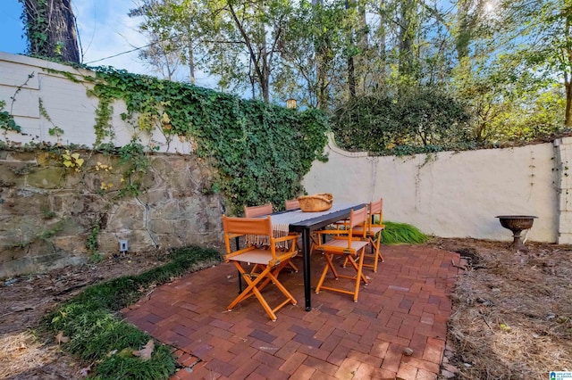 view of patio with fence and outdoor dining space