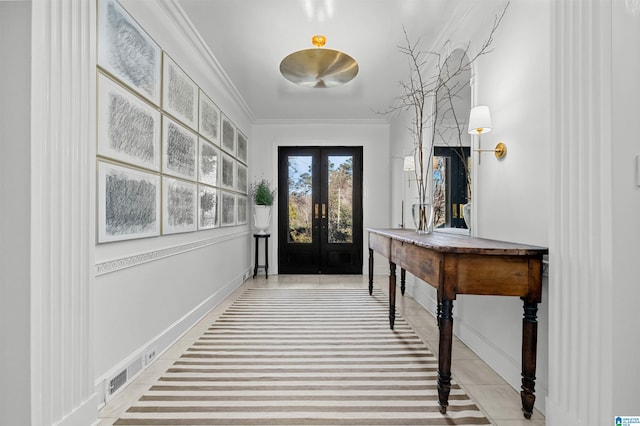 doorway featuring ornamental molding, french doors, and baseboards