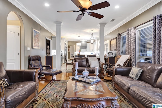 living area with recessed lighting, visible vents, a ceiling fan, ornamental molding, and ornate columns