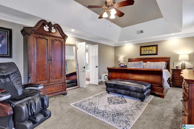 bedroom featuring visible vents, a raised ceiling, and ornamental molding