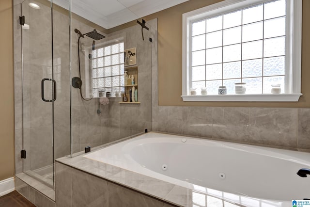 full bathroom with ornamental molding, a stall shower, and a jetted tub