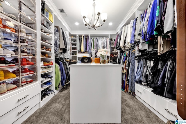 walk in closet with a chandelier, carpet, and visible vents