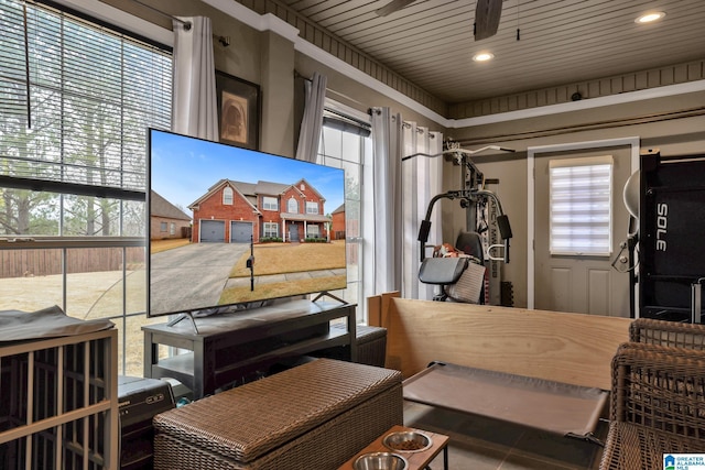 interior space with a ceiling fan and wood ceiling