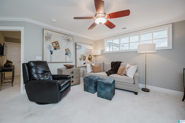 living area featuring carpet floors, crown molding, visible vents, a ceiling fan, and baseboards