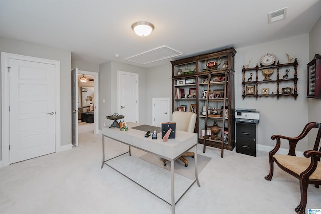 office area featuring attic access, light carpet, visible vents, and baseboards