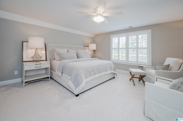 bedroom featuring a ceiling fan, carpet flooring, visible vents, and baseboards