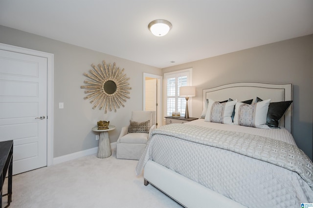 bedroom featuring baseboards and carpet flooring