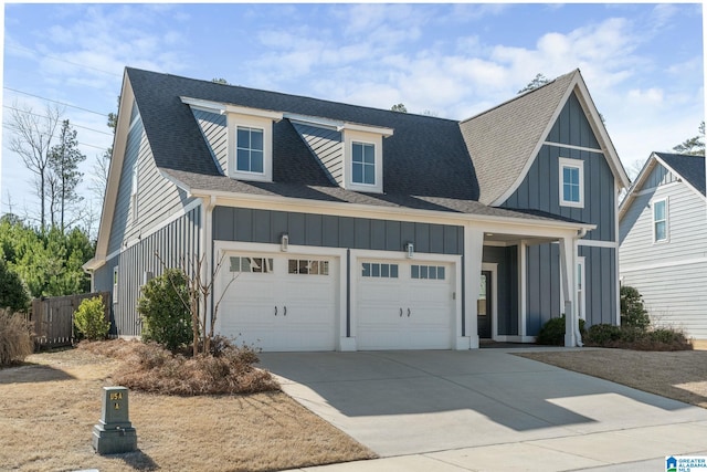 modern farmhouse with driveway, a shingled roof, board and batten siding, and an attached garage