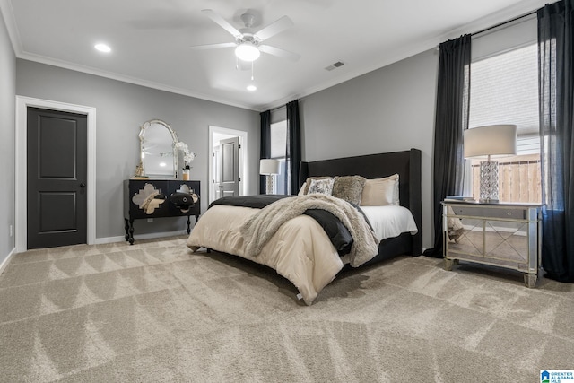 bedroom featuring carpet, visible vents, crown molding, and multiple windows