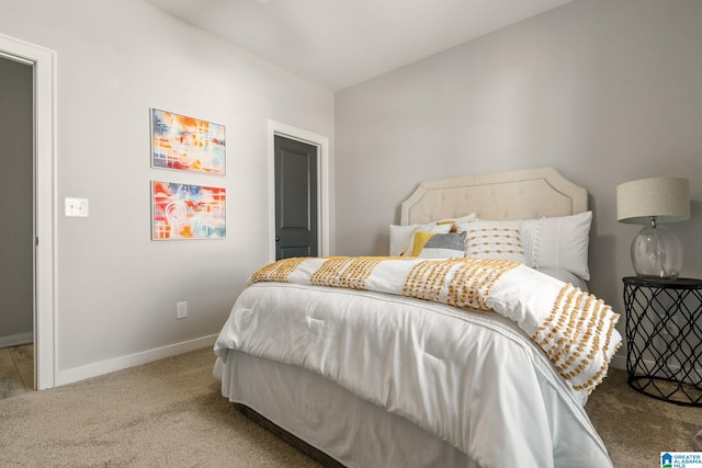 bedroom with carpet and baseboards