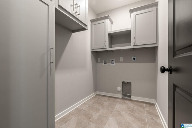 laundry area with washer hookup, light tile patterned floors, cabinet space, electric dryer hookup, and baseboards