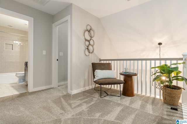 sitting room with carpet, visible vents, and baseboards