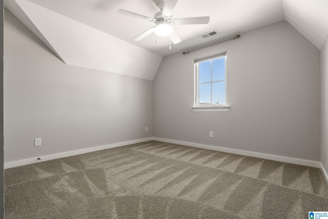 bonus room with visible vents, vaulted ceiling, and carpet flooring