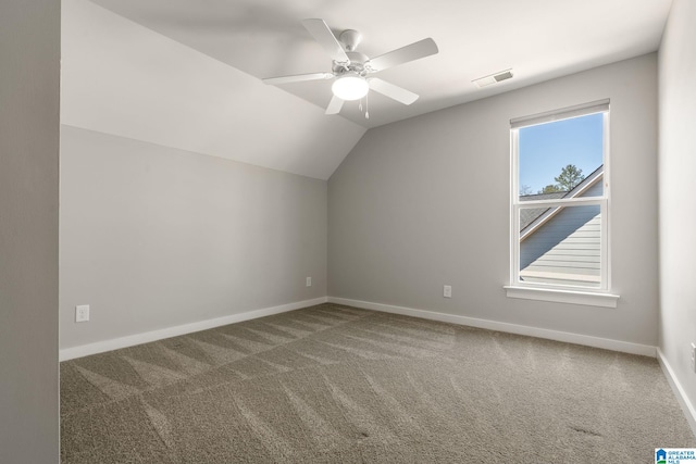 bonus room featuring baseboards, visible vents, ceiling fan, vaulted ceiling, and carpet floors