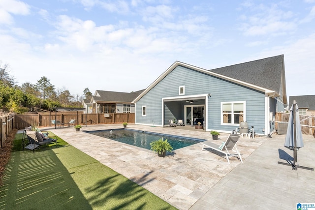 view of pool with a fenced backyard, a fenced in pool, and a patio