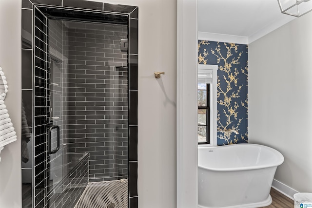 1165 Cedar Creek Dr, Sylacauga, AL 35151 - full bath with baseboards, a soaking tub, wallpapered walls, a stall shower, and crown molding