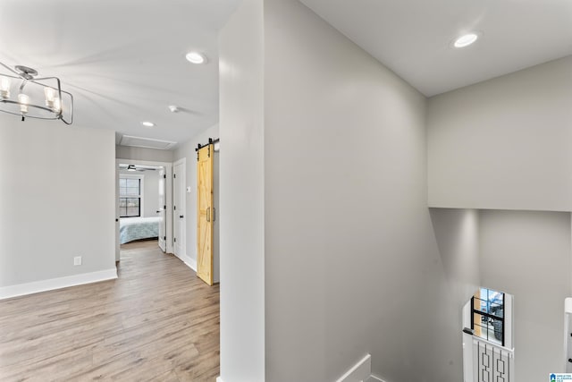 1165 Cedar Creek Dr, Sylacauga, AL 35151 - corridor featuring light wood-style floors, recessed lighting, baseboards, and a barn door