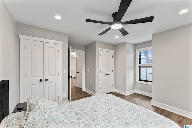 1165 Cedar Creek Dr, Sylacauga, AL 35151 - bedroom with baseboards, dark wood-style flooring, recessed lighting, and multiple closets