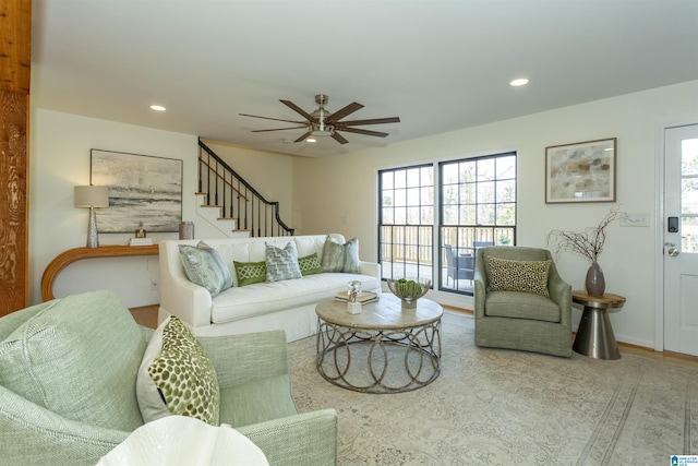 living area with recessed lighting, a healthy amount of sunlight, ceiling fan, and stairs