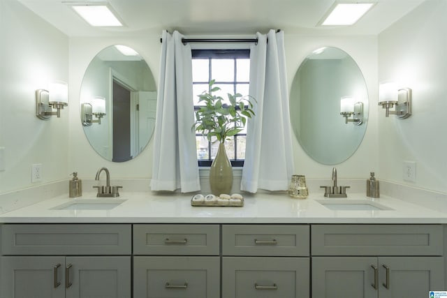 full bathroom featuring a sink and double vanity