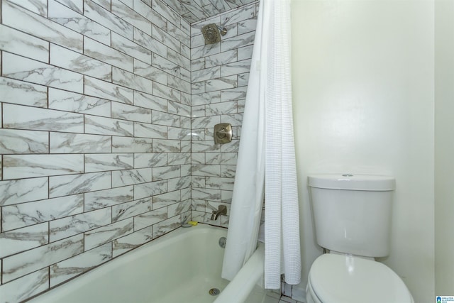 bathroom featuring toilet and shower / tub combo