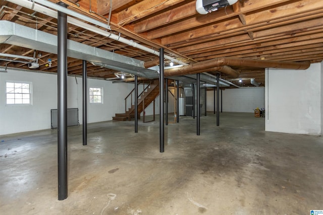 basement with stairs and water heater