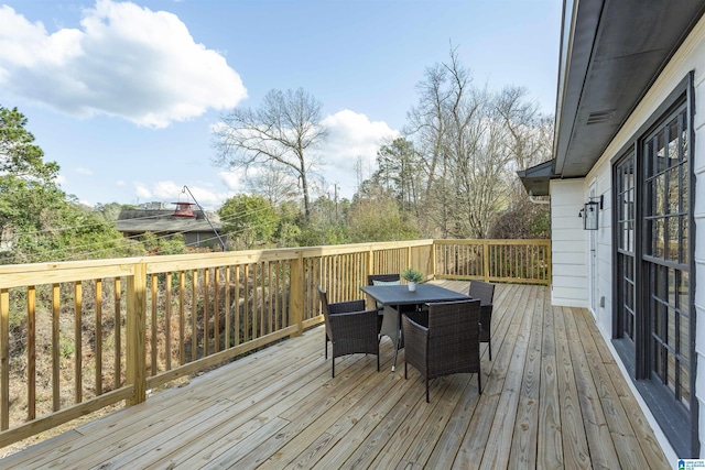 wooden deck with outdoor dining space