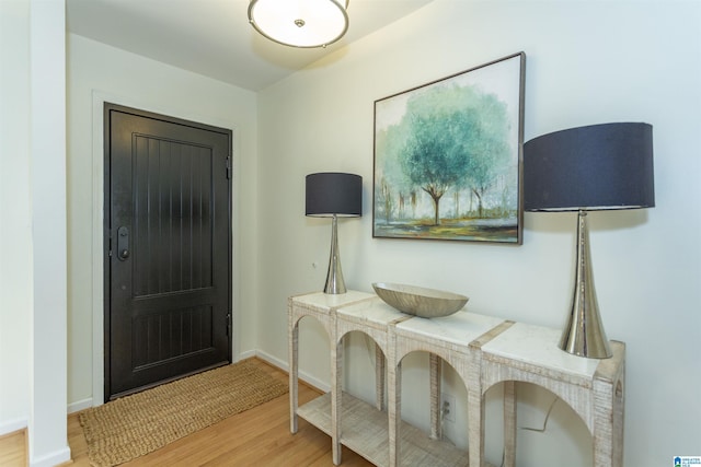 foyer featuring light wood-type flooring and baseboards