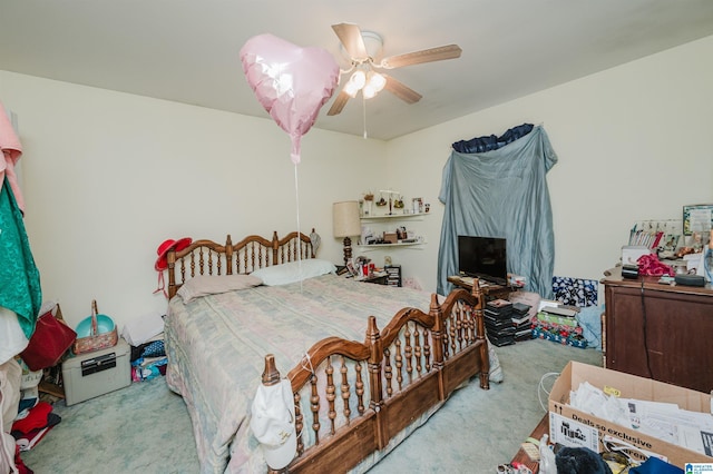 carpeted bedroom featuring a ceiling fan