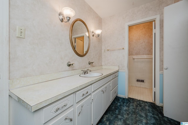 bathroom with visible vents and vanity