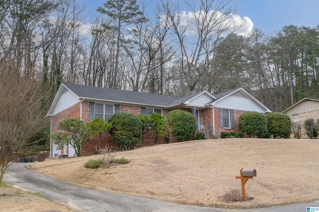 single story home with brick siding