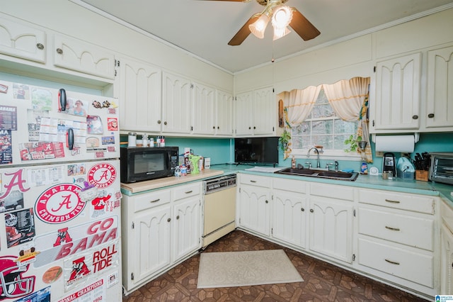 kitchen with white appliances, dark floors, white cabinetry, and a sink