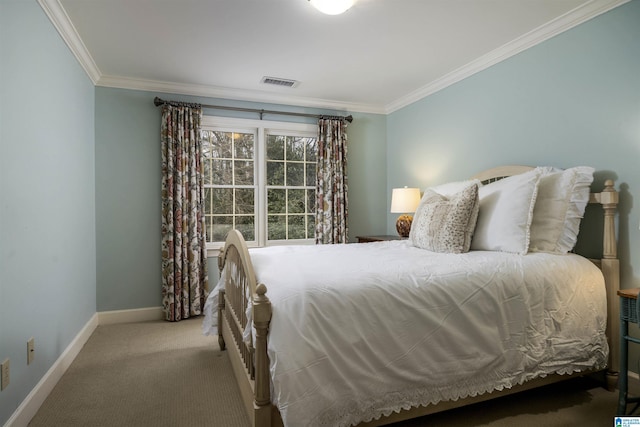 bedroom featuring ornamental molding, carpet, visible vents, and baseboards