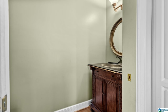 bathroom with vanity and baseboards