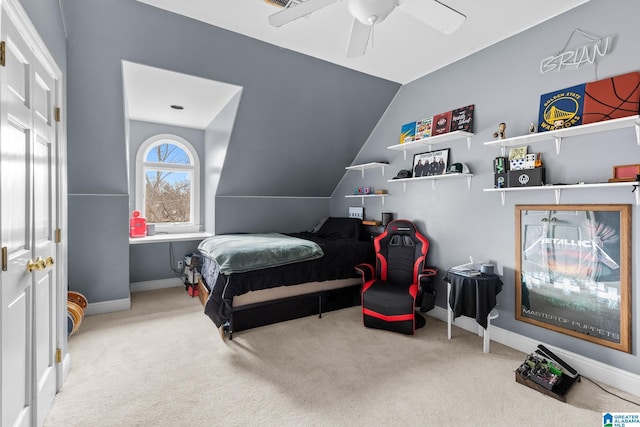 carpeted bedroom with lofted ceiling, ceiling fan, and baseboards