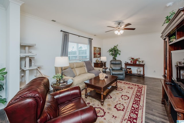 living room featuring visible vents, dark wood finished floors, and ornamental molding