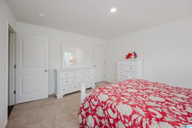 bedroom with light carpet, baseboards, and recessed lighting