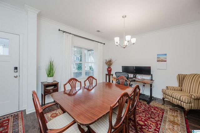 dining space featuring dark wood-style floors, a chandelier, crown molding, and baseboards