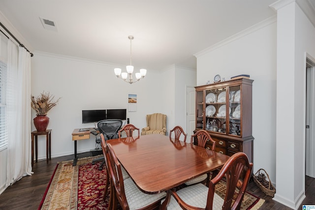 dining area featuring visible vents, baseboards, ornamental molding, dark wood-style floors, and an inviting chandelier