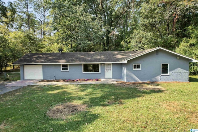 single story home with a garage, concrete driveway, a front lawn, and stucco siding