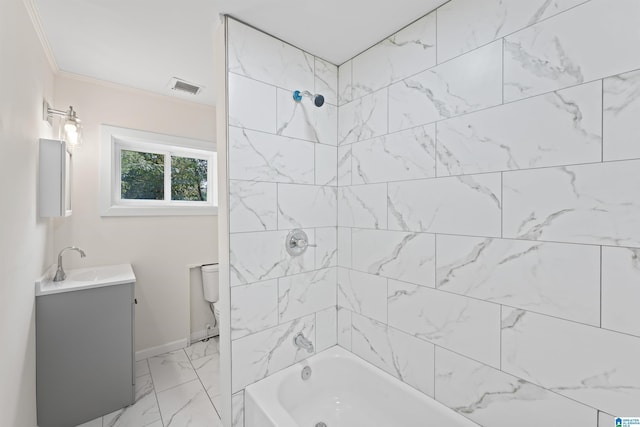 bathroom featuring marble finish floor, shower / bath combination, toilet, ornamental molding, and vanity