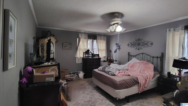 bedroom with a textured ceiling, carpet flooring, and crown molding