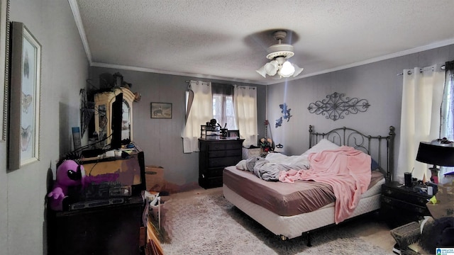 bedroom with a textured ceiling, crown molding, a ceiling fan, and carpet