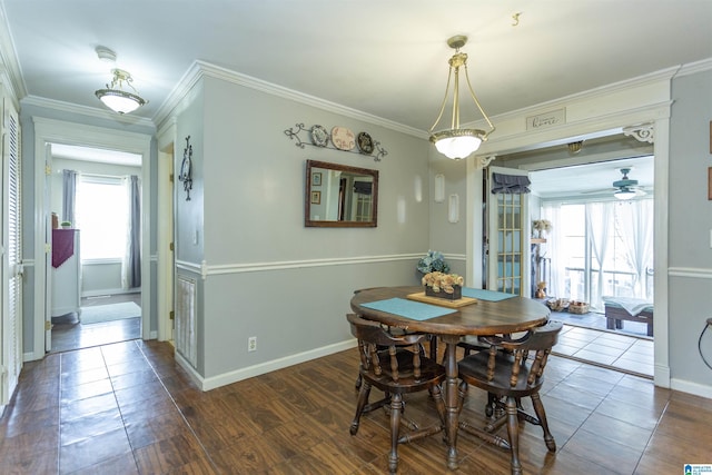 dining area with ceiling fan, baseboards, dark wood-style flooring, and crown molding