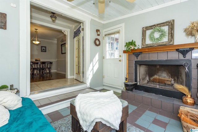 living area featuring baseboards and ornamental molding