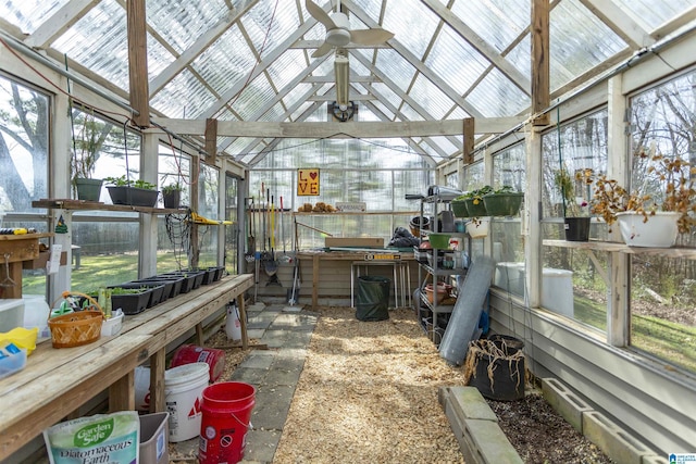 sunroom / solarium with ceiling fan and vaulted ceiling