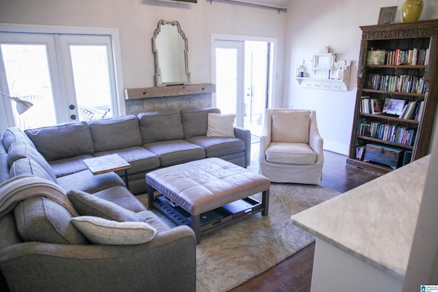 living room with dark wood finished floors and french doors