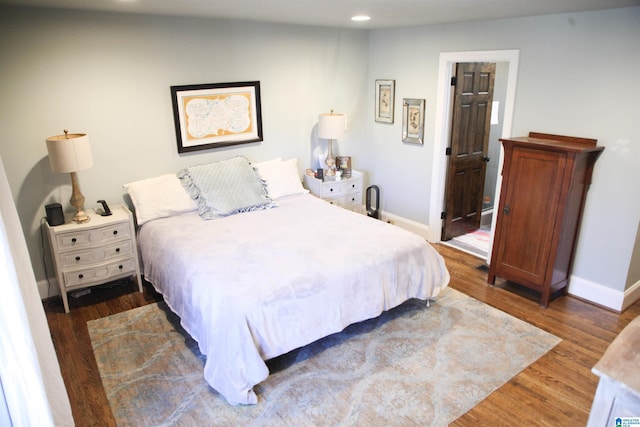 bedroom featuring recessed lighting, baseboards, and wood finished floors