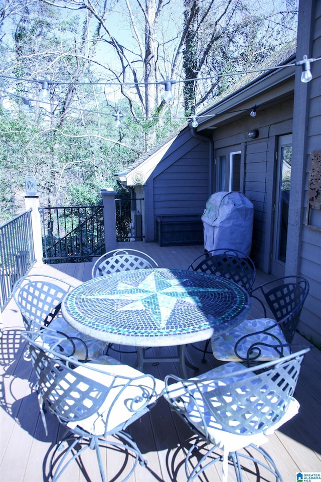 wooden deck with outdoor dining area